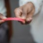 crop faceless black people holding red small paper tickets